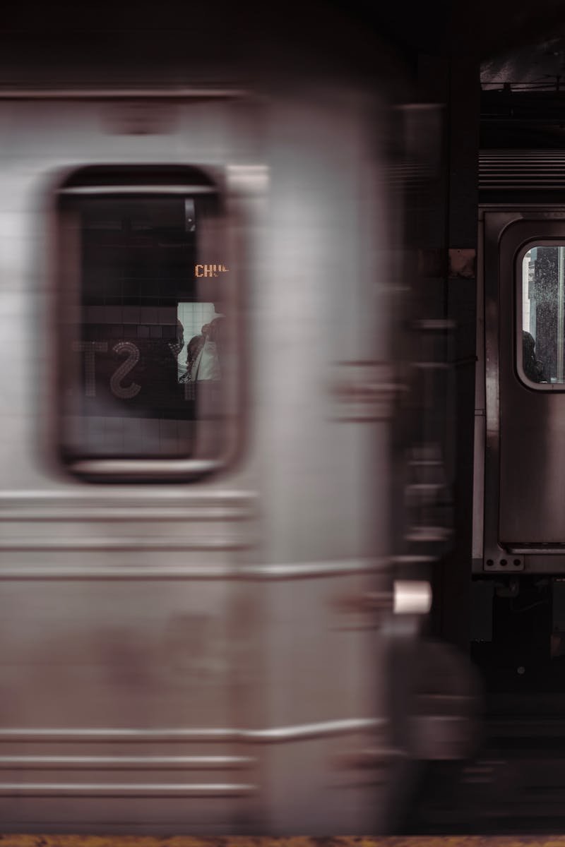 Dynamic shot of a subway train in motion, capturing the energy of public transportation.
