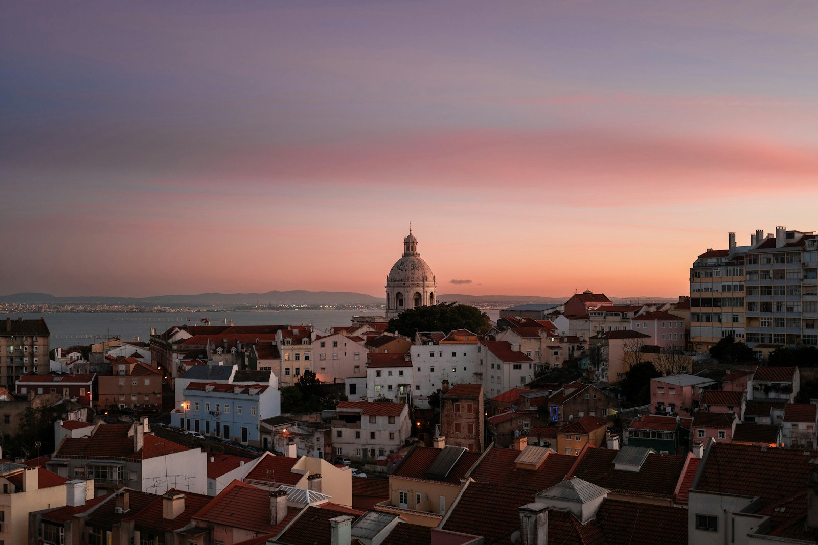 Lisbon's skyline glows under a beautiful sunset.